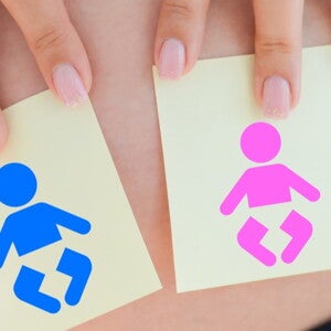 pregnant woman deciding on baby boy or girl names pregnant woman deciding on baby boy or girl names