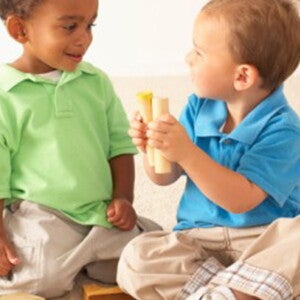Baby boys playing with wooden toys Baby boys playing with wooden toys